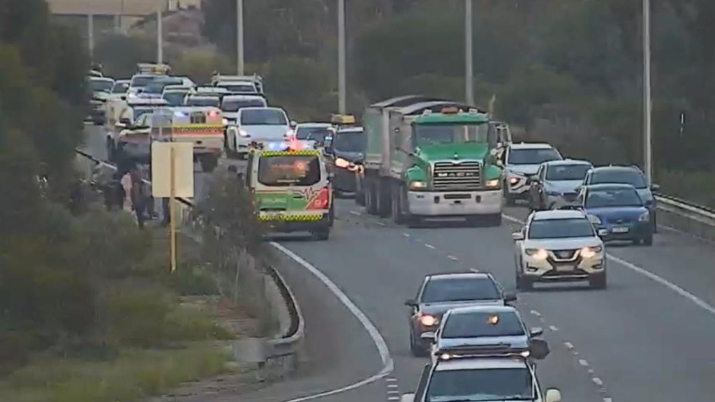 Person trapped in flipped vehicle after crash on Reid Highway causing peak hour traffic delays