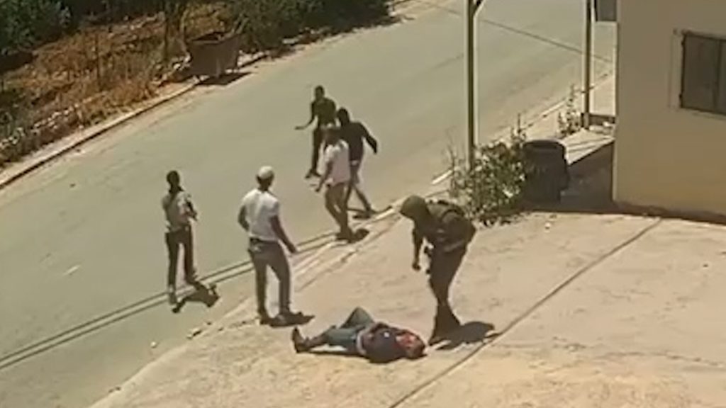 Video shows Israeli soldier and settlers assaulting two Palestinians | Occupied West Bank