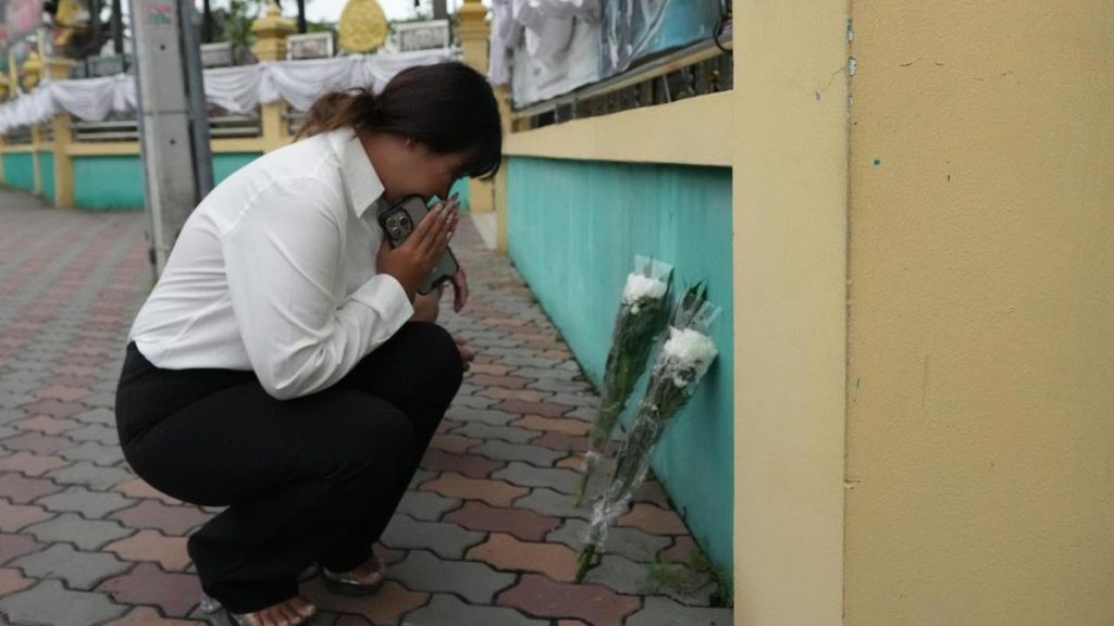 Thai families retrieve bodies after school shooting