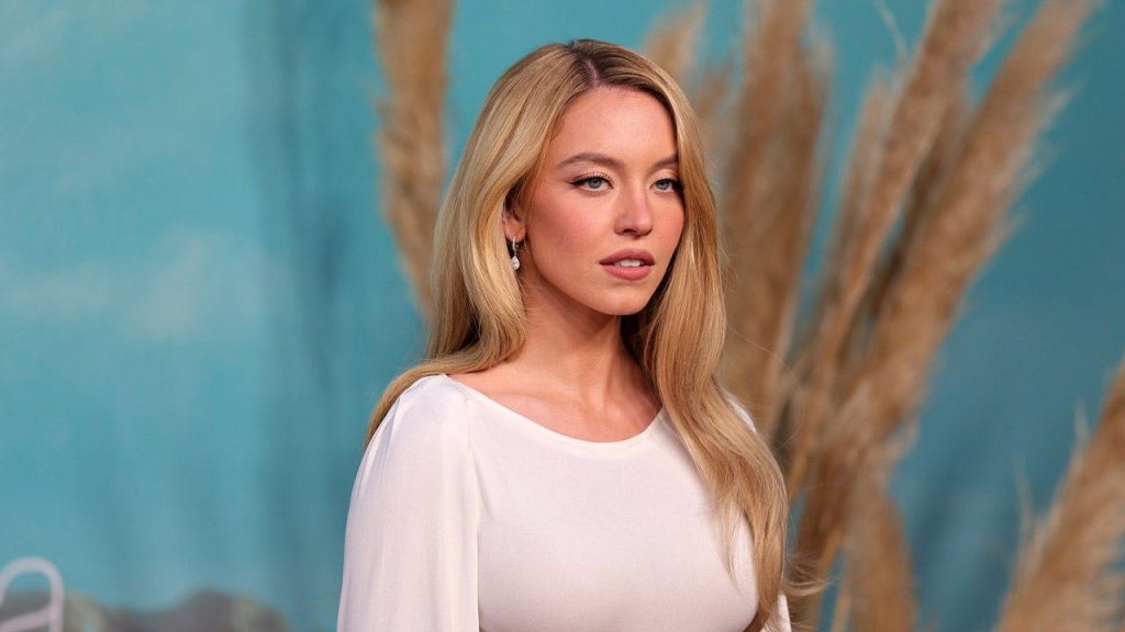 Sydney Sweeney sports ‘SB’ necklace in new SYRN lingerie campaign