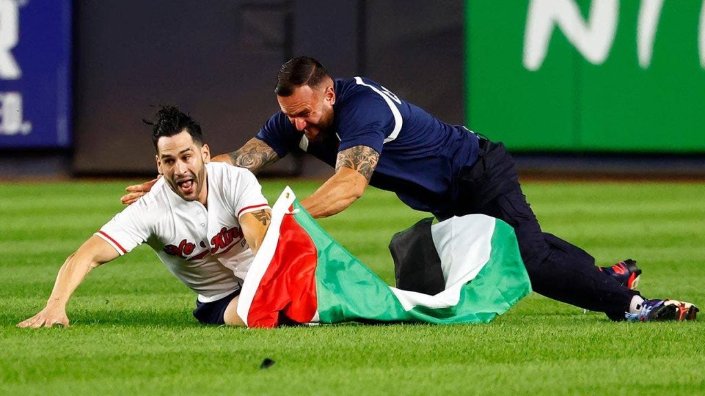 Yankee stadium security tackles field invader waving Palestinian flag during 9/11 anniversary game