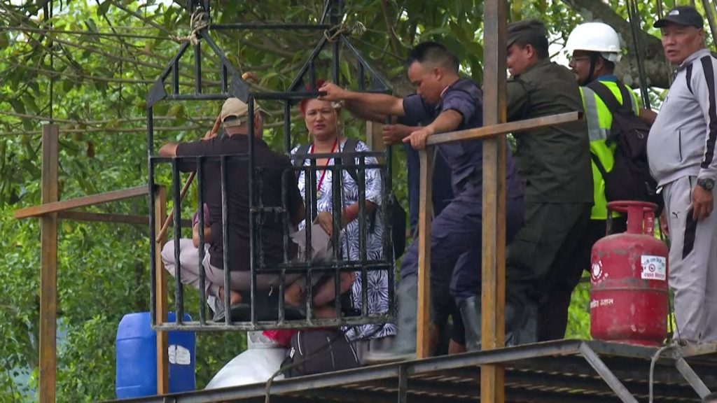 Stranded survivors in Nepal cross raging Trishuli River using zip line | Floods