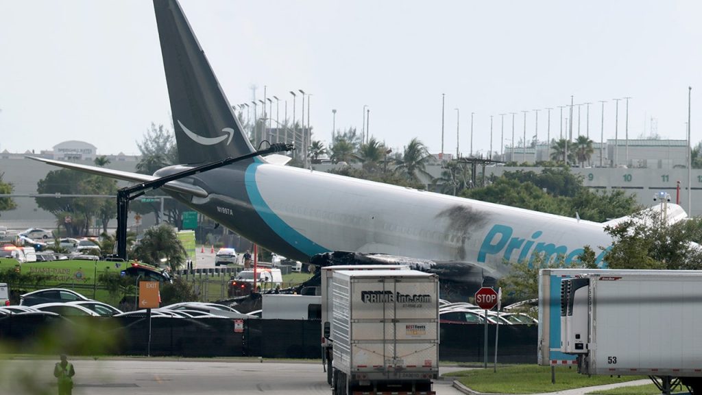 Amazon cargo jet overruns runway at Miami airport, striking multiple vehicles