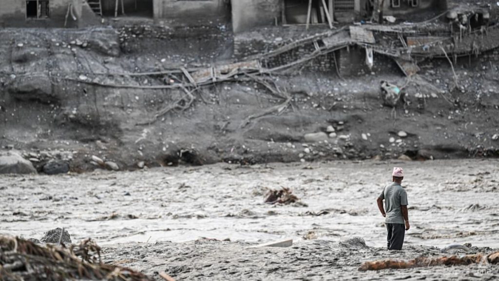 Nepal’s riverside communities cling to hope with loved ones missing after deadly flood