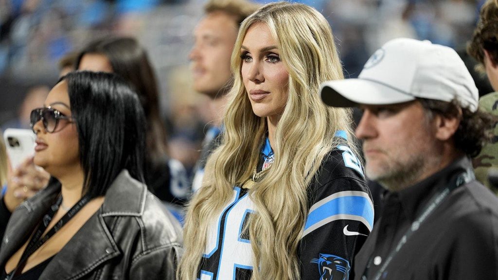 WWE star Charlotte Flair struts into Panthers’ stadium, bangs the drum before game vs Lions