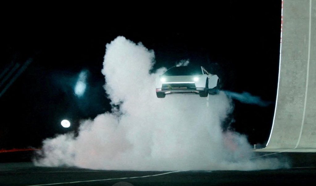 Tesla unveils car that can drive upside down and jump through the air | Elon Musk